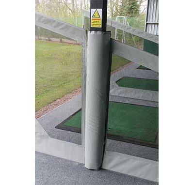 Padded Stanchion Cover in between two dividers on driving range
